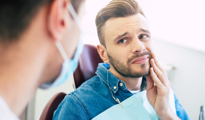 Symptoms,Of,Gums,Pain.,A,Man,With,A,Worried,Face